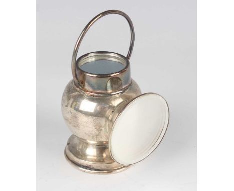 A George V silver novelty inkwell in the form of a railway lamp, the detachable cover fitted with a handle and a mirror, abov