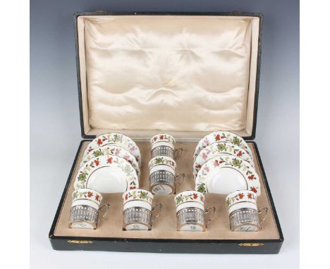 A set of six George V silver coffee can holders with Aynsley bone china liners and saucers, Birmingham 1914 by Philip Hanson 