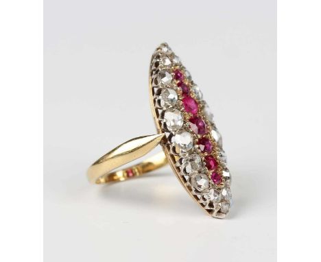 A gold and silver, diamond, ruby and red gem set marquise shaped cluster ring, mounted with a row of seven graduated rubies a