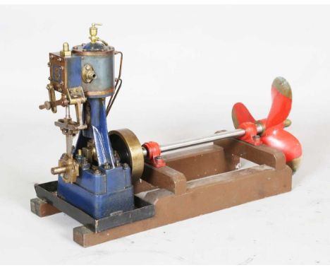 A Stuart Turner No. 5 vertical steam engine with reversing gear, driving a 12.5cm flywheel, prop-shaft and boat propeller, mo