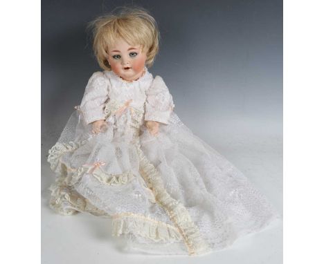 A Kammer &amp; Reinhard bisque head doll, impressed '126', with later blonde wig, sleeping blue eyes, painted eyebrows and la