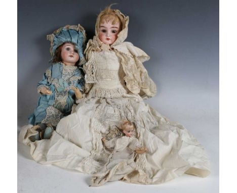 A German bisque head and shoulders doll, impressed 'Darling 4/0', possibly Kammer &amp; Reinhardt, with blonde wig, sleeping 