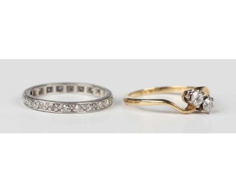 A platinum and diamond eternity ring, mounted with circular cut diamonds, detailed ‘Plat’, weight 2.7g, ring size approx L, a