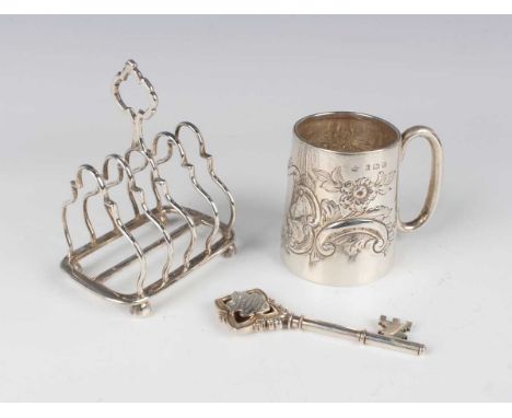 A late Victorian silver tapering cylindrical christening tankard, embossed with a vacant cartouche flanked by flowers and 'C'