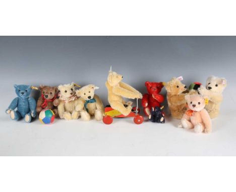 A small group of Steiff teddy bears, comprising No. 671517 pair of teddy bears with a ball, No. 029233, No. 029226, No. 02938