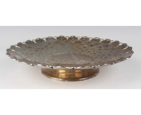 An Elizabeth II silver circular low tazza, the centre with fish scale decoration within a cast and pierced petal rim, on a ci