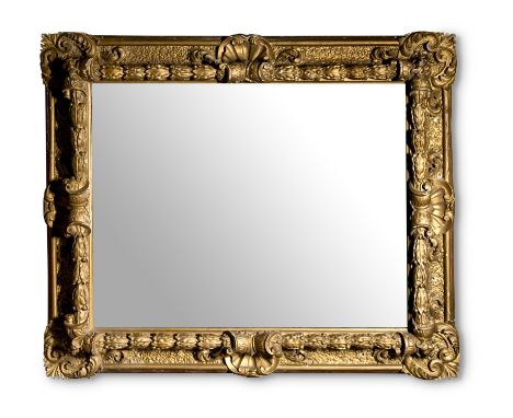 A CARVED GILTWOOD AND COMPOSITION WALL MIRRORLATE 19TH CENTURY126cm high, 152cm wideCondition Report: Marks, knocks, scratche