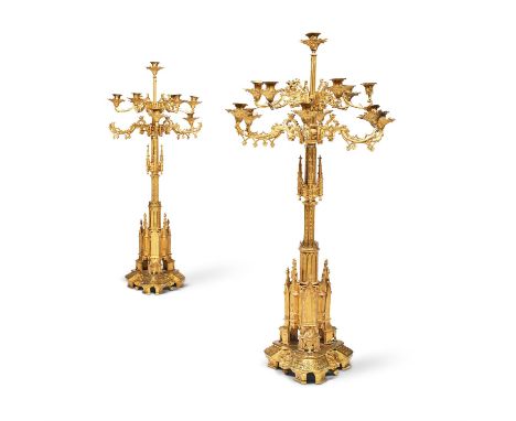 A PAIR OF IMPRESSIVE GILT BRASS GOTHIC REVIVAL CANDELABRA, SECOND HALF 19TH CENTURY, ENGLISH OR FRENCHEach with two tiers of 