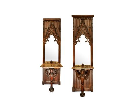 A PAIR OF GOTHIC REVIVAL CARVED OAK MIRRORED CONSOLE TABLESTHIRD QUARTER 19TH CENTURY AND LATERThe marble top supported on a 