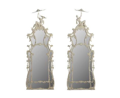 A PAIR OF GEORGE III STYLE CARVED AND WHITE PAINTED PIER MIRRORS MODERN, IN THE MANNER OF JOHN LINNELLThe crestings respectiv