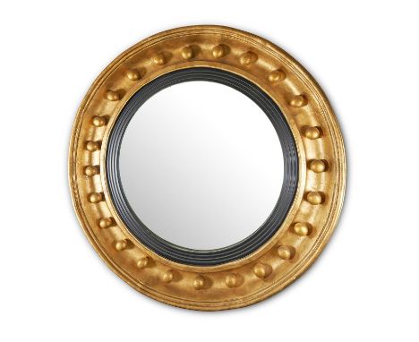 A PAIR OF MONUMENTAL GILT AND COMPOSITION CONVEX WALL MIRRORS, IN REGENCY STYLE20TH CENTURYEach of traditional form with ball