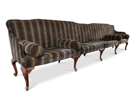 AN EXTENSIVE SIX SEAT SOFA IN GEORGE III STYLE20TH CENTURYThe yoked back above five cabriole legs93cm high, 400cm wide, 58cm 