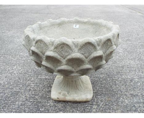 Garden Stoneware - A reconstituted stone pineapple pattern planter on circular base.