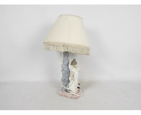 A Nao figural table lamp, approximately 38 cm (h).