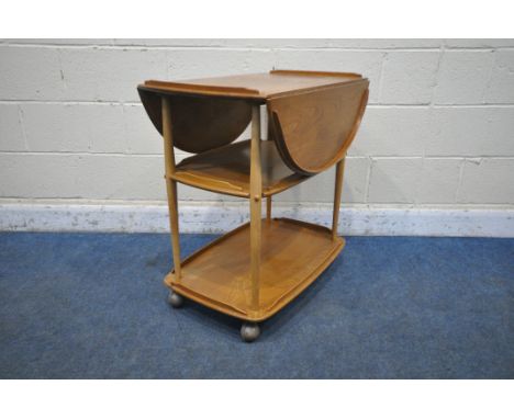 AN ERCOL ELM AND BEECH THREE TIER DROP LEAF TEA TROLLEY, open width 96cm x closed with 48cm x depth 74cm x height 76cm (condi