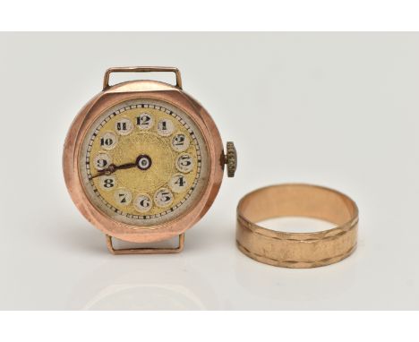 A 9CT YELLOW GOLD RING AND A 1920S 9CT YELLOW GOLD WATCH HEAD (AF), the ring designed as a plain polished band with textured 