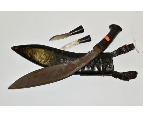 A NEPALESE GURKHA KUKRI KNIFE, in its leather scabbard complete with its Kardar and Chakma knives