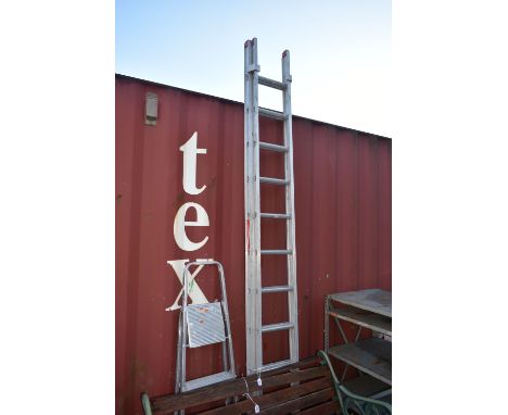 A TITAN COMPETITOR ALUMINIUM DOUBLE EXTENSION LADDER, closed 3m, along with an aluminium step ladder (2)
