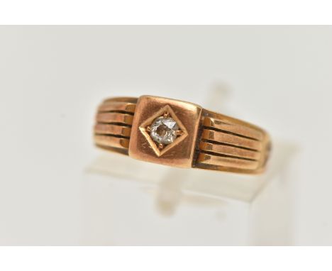 A LATE VICTORIAN DIAMOND SIGNET RING, old cut diamond claw set in a polished square mount, textured shoulders leading onto a 