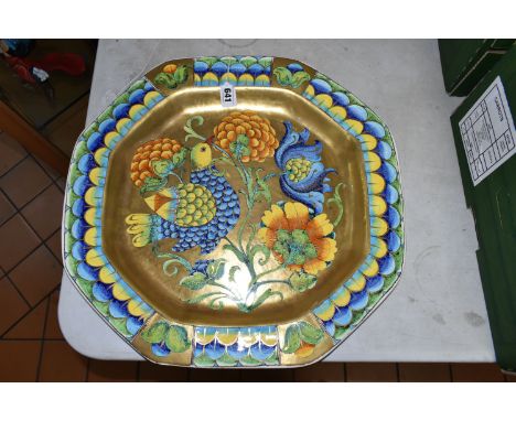 A PAOLO MARIONI ITALIAN POTTERY OCTAGONAL CHARGER, crackle glazed, the gilt ground polychrome enamelled with a border of styl