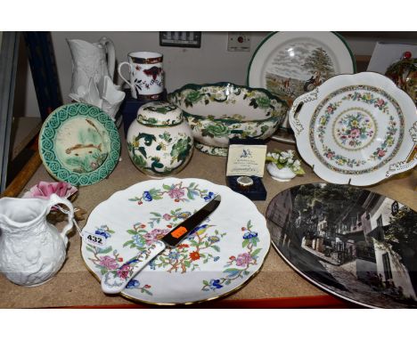 A GROUP OF NAMED CERAMICS, comprising a Majolica circular trivet with a green border and brown trout design, a Portmeirion 'B