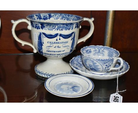 FOUR PIECES OF 19TH CENTURY WESLEY COMMEMORATIVE BLUE AND WHITE TRANSFER PRINTED POTTERY, comprising a pearlware twin handled