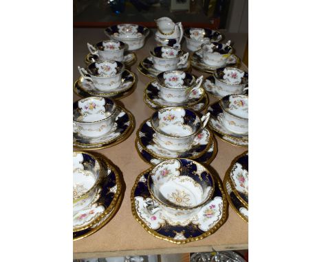 A COALPORT BLUE 'BATWING' TEA SET, comprising a milk jug, sugar bowl, slop bowl, twelve cups, twelve saucers, eleven tea plat