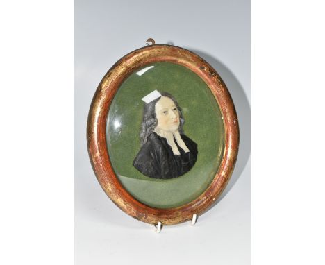 A MOULDED WAX PORTRAIT BUST OF REV. JOHN WESLEY, mounted on green velvet and in an oval gilt frame, glazed, height of bust 9.