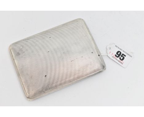A SILVER CIGARETTE CASE, of a rectangular form, engine turned pattern, sliding mechanism, gilt interior with two yellow elast