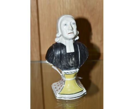 AN EARLY 19TH CENTURY STAFFORDSHIRE PEARLWARE BUST OF REV. JOHN WESLEY RAISED ON A SOCLE STYLE BASE, painted decoration, heig