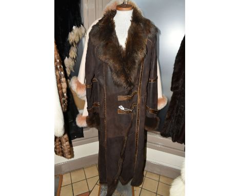 A SUEDE CAPE WITH FUR COLLAR AND BROWN LEATHER LADIES SHEEPSKIN, comprising an apricot coloured suede cape with an apricot co