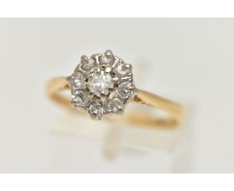 A DIAMOND CLUSTER RING, round brilliant and single cut diamonds set in a white metal mount, leading onto a yellow metal shank