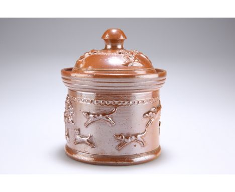 A 19TH CENTURY SALT-GLAZED STONEWARE TOBACCO JAR, with sprigged decoration of a hunting scene, the domed cover enclosing an i