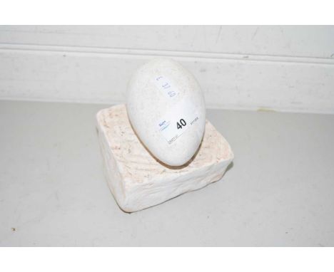 Composition model of an egg on plinth base