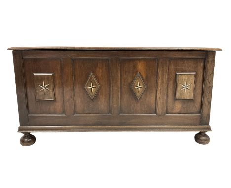 19th century oak coffer, the hinged lid over four panel base, raised on bun feet Dimensions: Height:&nbsp;69cm&nbsp; Length/W