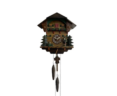 A Swiss made 20th century Cuckoo clock with automaton in a traditional chalet style case, movement sounding the hours and hal