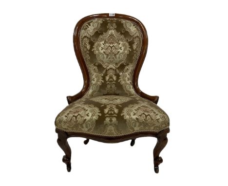 Victorian nursing chair, the mahogany show frame with floral upholstery, raised on ceramic castors  