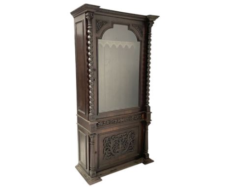 19th century oak gun cabinet, projecting leaf carved and moulded cornice, stepped shouldered arch glazed door flanked by two 