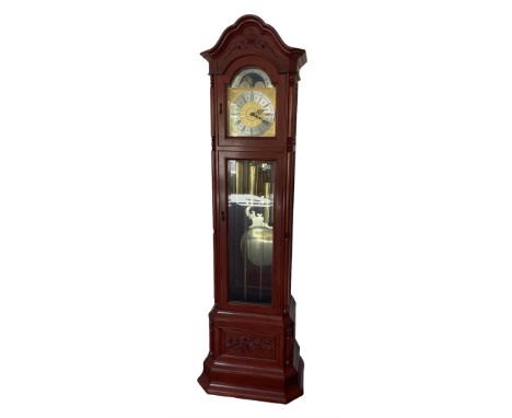 An impressive 20th century longcase clock in a mahogany case with an arched pediment, glazed and fretted side panels and glaz