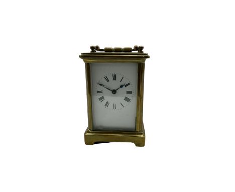 A French corniche carriage clock c1880 with five bevelled glass panels, enamel dial with roman numerals, minute track and ste