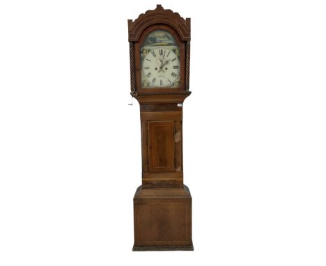 A Victorian mahogany longcase clock, with a break arch top and wavy pediment, break arch hood door with scalloped surround fl