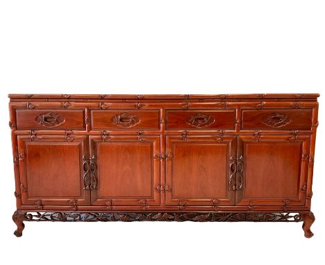 Chinese rosewood sideboard, the rectangular top over four drawers opening to reveal one adjustable shelf, raised on cabriole 