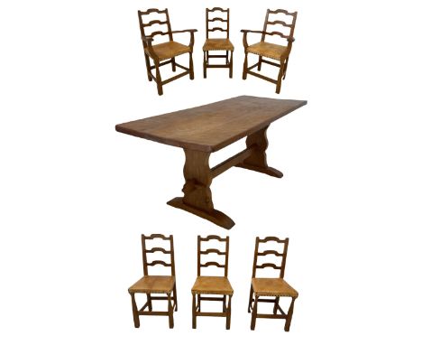 'Gnomeman' oak dining table, the adzed three plank top, together with a later oak top over shaped end supports and sledge fee