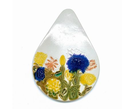 Ceramic tile hand-painted with green, cobalt blue, yellow, and brown glazes. Decorated with sunken relief of flowers. Stamped