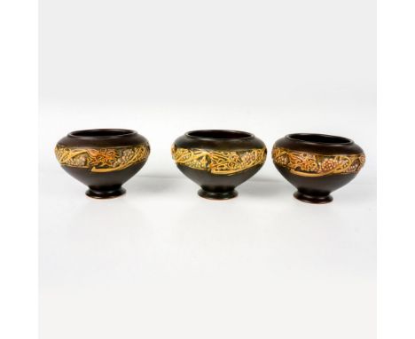 A set of 3 small footed bowls. Decorated in a brown semi-matte finished and adorned in an Art Nouveau style grape pattern. R 