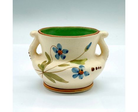 A small double-handled vase; cream-colored ground exterior, green interior, and brown trims. Hand painted blue five petal flo