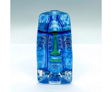 A clear paperweight featuring a hand painted blue and green debossed moai face. Sea Glasbruk sticker and artist signed on the