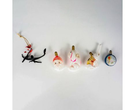 4 hand painted milk glass light bulbs each with a unique shape; a rabbit, an elephant, Santa Claus, and a bulb featuring holl