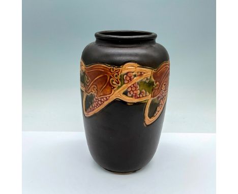 A beautiful vase in a brown semi-matte finished and adorned in an Art Nouveau style grape pattern. R stamped on the underside