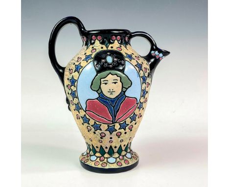 Handled vessel featuring an enamel scene in grey, black, pink, and blue coloration. Made In Czechoslovakia Amphora backstamp.